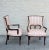 A Pair of 1950s Grosfeld House Style ebonized armchairs with striped upholstery.