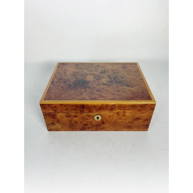 Large wooden box, France, 1970s, crafted from burl veneer with particularly rich and decorative patterns. Its surface...