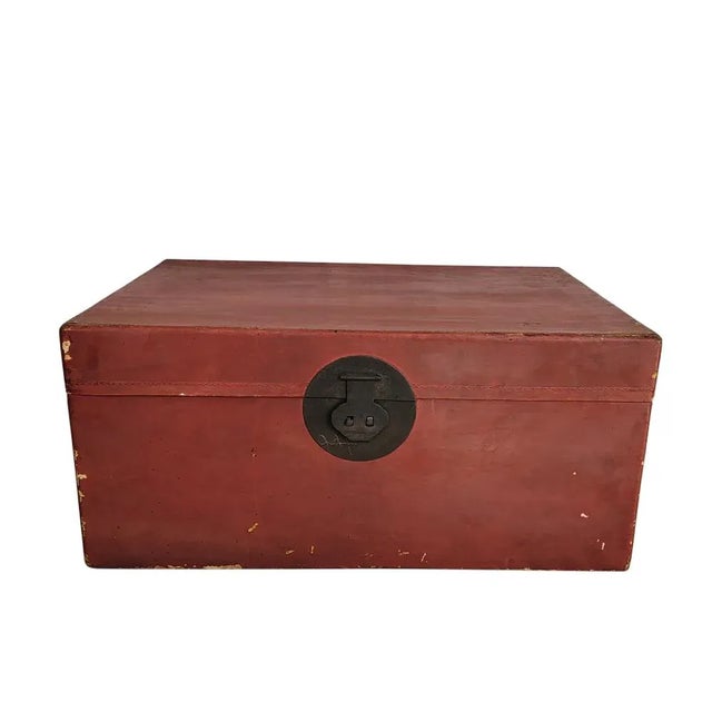 This earth 20th century trunk displays the influence from west countries. The interior is covered with blue fabric. The...