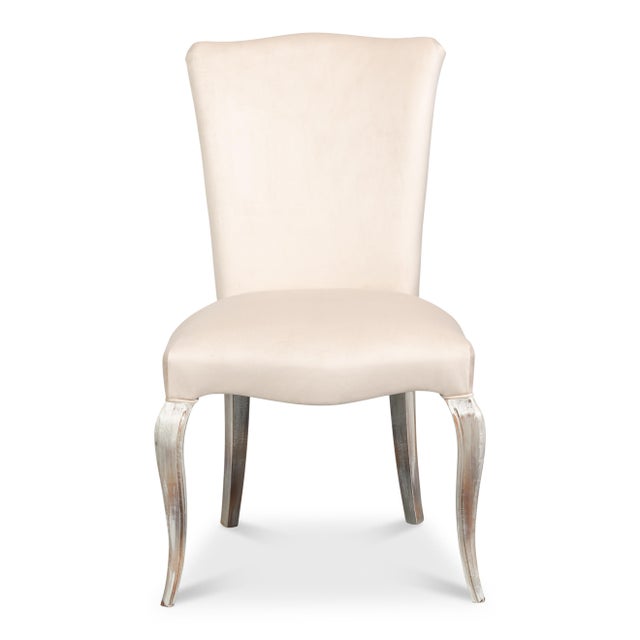 Pale, weathered cabriole legs establish the French character of the frame. A cabriole curve at the front, finished...