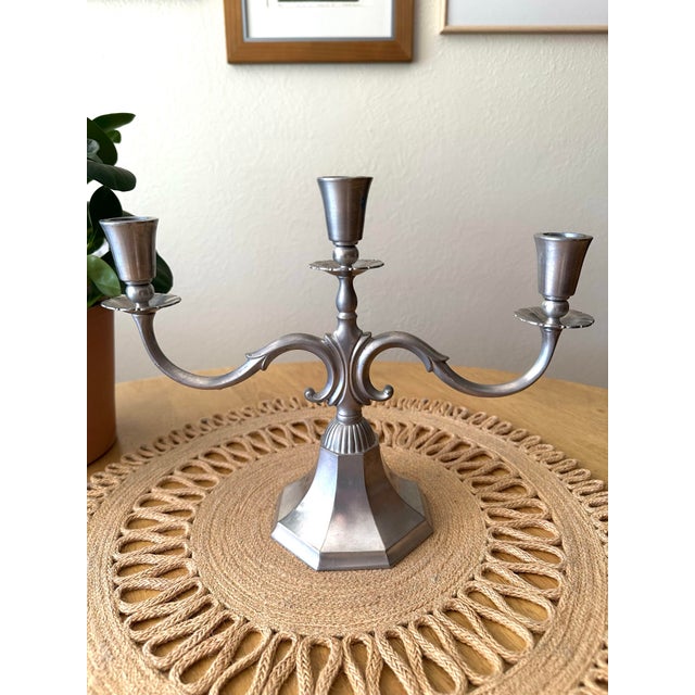 This is the prettiest pewter candle holder! Beautiful curved pewter candelabra holding three candle holders and an...