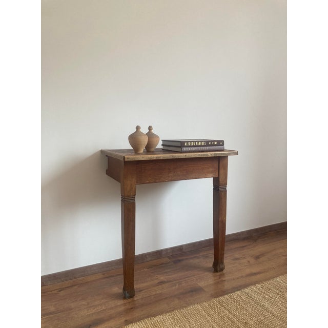 A charming pair of antique rustic pine console tables or side tables, France, late 19th to early 20th century. Each table...