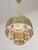 Takes 1x e27 light bulb (not included). A standard e26 american/canadian size also fits (tested). Works with 220v as well...