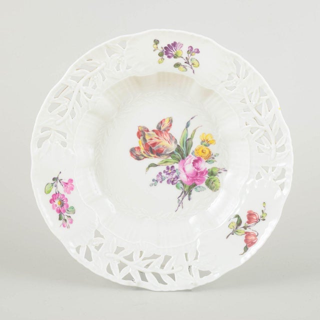 Royal Copenhagen Deep plate, early 20th century. Hand-painted porcelain with floral motif in multicoloured palette and...