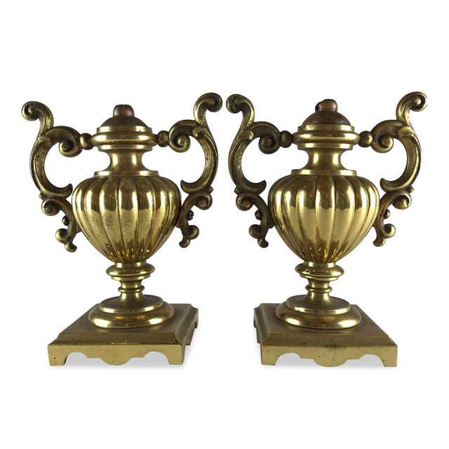 Pair of Antique Gilded Centerpiece Vases. Gilded bronze palm holders with polished mercury amalgam. A fluted amphora with...