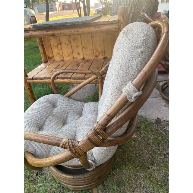 Mid century BOHO style Ratan swivel chair with light gray pad. Great condition