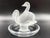 A "Deux Cygnes" ring plate by Lalique features a stunning pair of swans sculpted in frosted crystal. Swans, known as a...