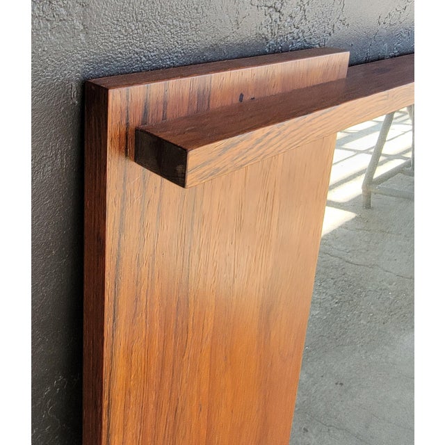 Scandinavian Modern rectangular rosewood wall mirror with Andr. L. Riss paper label. Norway, circa. 1960's. Andr. L. Riss...
