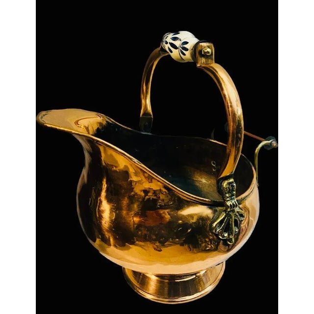 Antique Copper Coal Ash Scuttle Bucket with brass accents and porcelain handle. Circa 19th Century