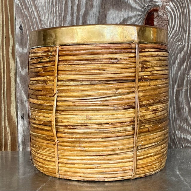 Add a touch of natural elegance to your décor with this Vintage Coastal Brass and Reed Planter. This stunning piece...