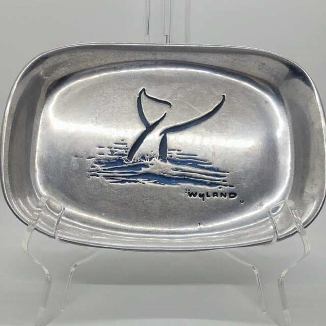 Wilton Armetale pewter bread tray features a striking whale tail design by renowned marine artist Wyland. This oval...