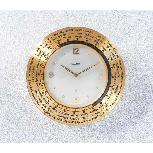 Luxor table clock with rotating time zone bezel, atisa advertising. Manual 8-day winding. Switzerland, 1960s origin...