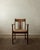 An antique dutch art deco armchair in oak and woven rush, made by an unknown dutch maker and likely produced in the...