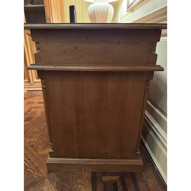 A timeless double pedestal executive desk crafted in solid wood, showcasing clean traditional lines and understated...