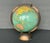 This vintage globe by Replogle shows the world on the brink of World War II. The scarce 8-inch diameter globe has a domed...