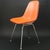 A charles and ray eames wire chair from herman miller white painted grid shell with lightly padded artificial leather...