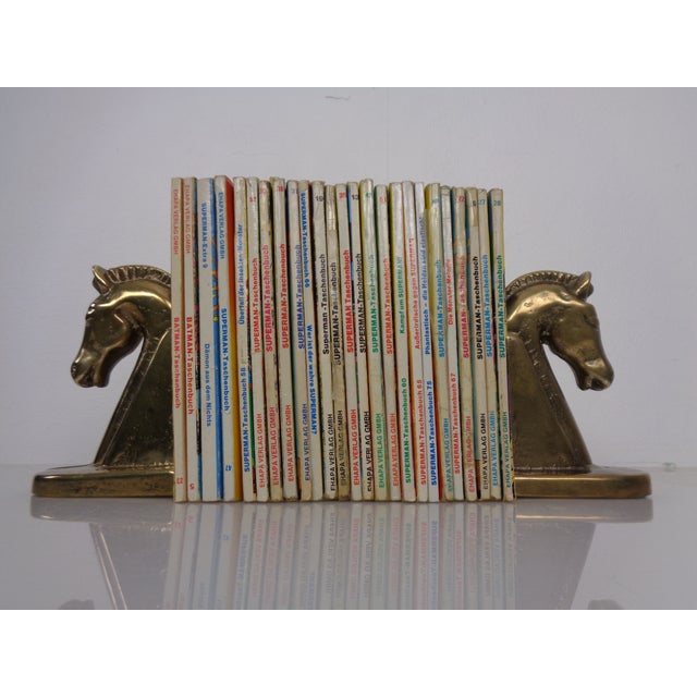 Two brass or bronze bookends in the shape of horses from the 1960s.