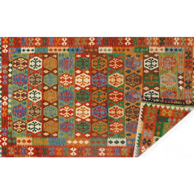 Add a touch of elegance to your home with this casual chic hand woven Kilim wool rug. Constructed on a loom by Nomad...