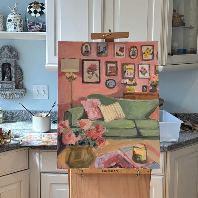 A cheerful, impressionistic interior scene featuring a soft green sofa set against a warm coral wall adorned with an...