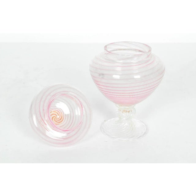 This Vintage pink swirled Murano glass decorative covered dish is in excellent condition. The dish measures 6 inches high...