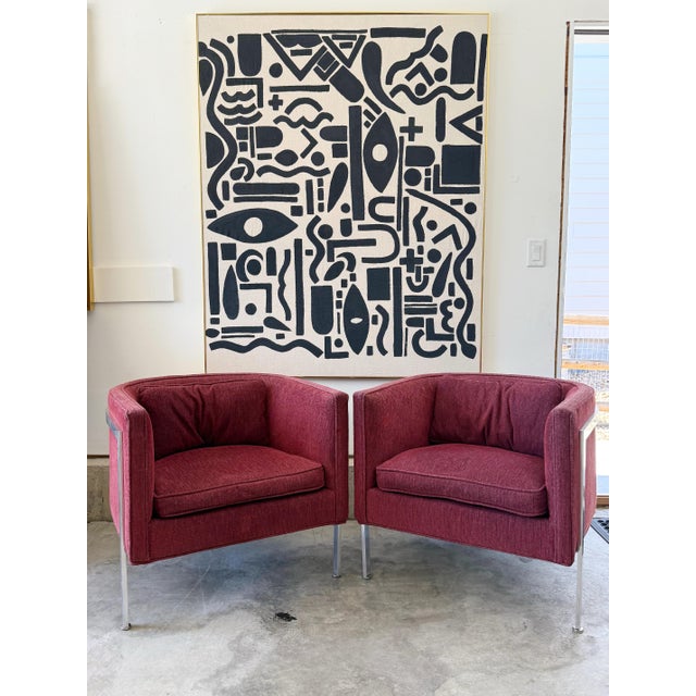 A rare and sculptural pair of three legged chrome chairs in the style of Harvey Probber — these cube lounge chairs strike...