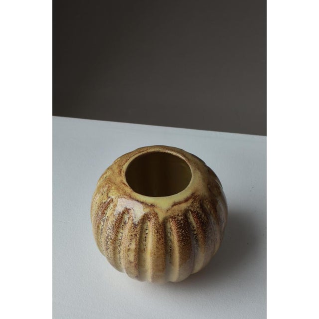 Sculptural Art Deco ceramic vase designed by Futurum for Upsala-Ekeby, Sweden, circa 1930s. The vase features a rounded,...