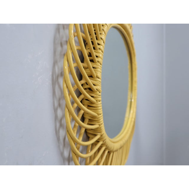 This authentic 1960s wicker mirror, design attributed by the legendary Franco Albini, is a masterclass in artisanal...