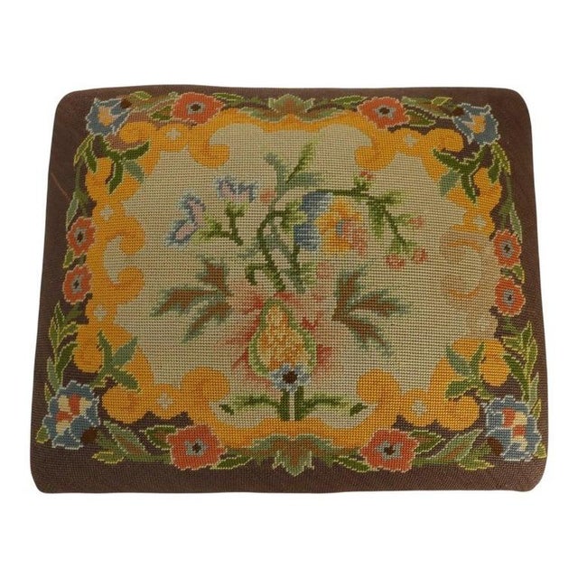 An antique American Empire mahogany and needlepoint ottoman, dating to approximately 1860. This charming footstool...