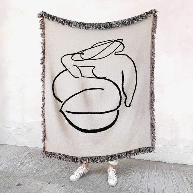 Woven throw blanket, 50"x60" (127x152cm) Abstract female figure illustration on natural light beige background. Our...