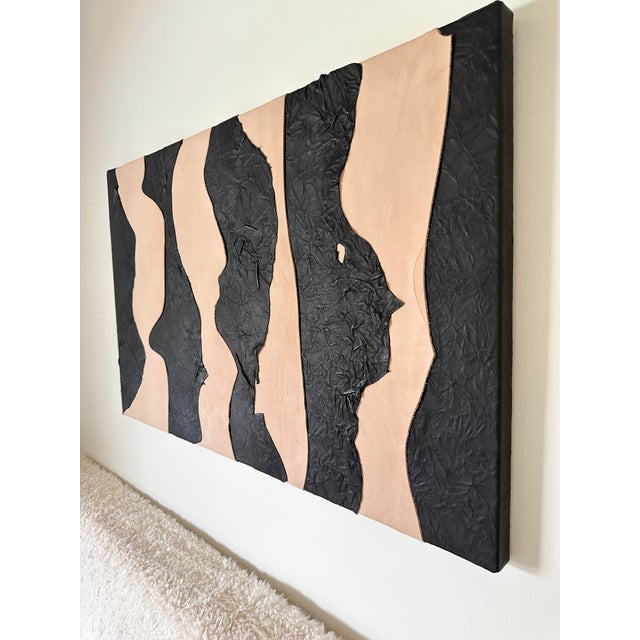 This piece can be hung horizontally or vertically. The layered leather on canvas evokes the desert landscapes of the...
