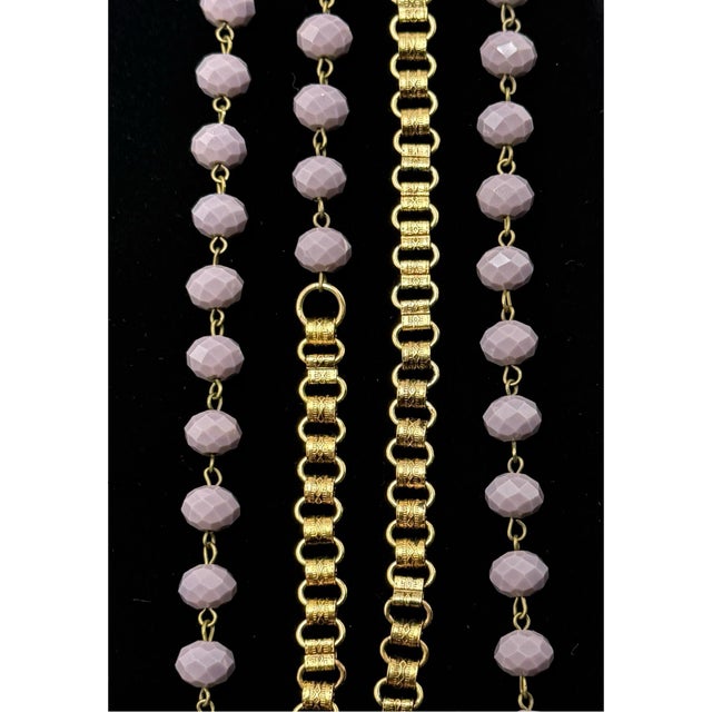 Antique Victorian book chain necklace with lavender glass beads. Measures a long 46”.