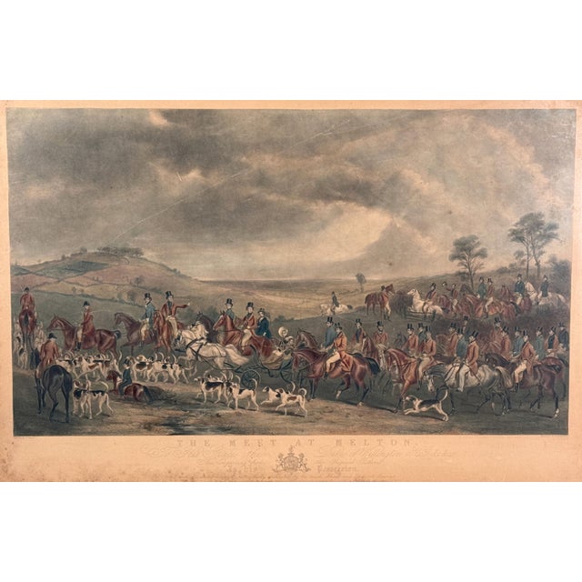 This large antique 19th century hand-colored engraving titled The Meet at Melton depicts an elaborate fox hunting scene...