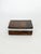 A brown onyx box, an elegant decorative piece from the 1970s, with a simple and refined design. This rectangular box is...