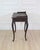 Made in Sweden in the twentieth century, this black Rococo-style writing desk has a tabletop framed on three sides and a...