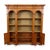This is a 1970s Italian neoclassical style carved fruitwood library bookcase or cabinet. It breaks down into three parts...