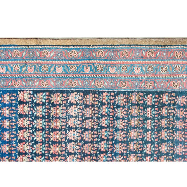 A beautiful early 20th century Persian Bidjar runner with a field woven with an all-over repeated multi-colored floral...