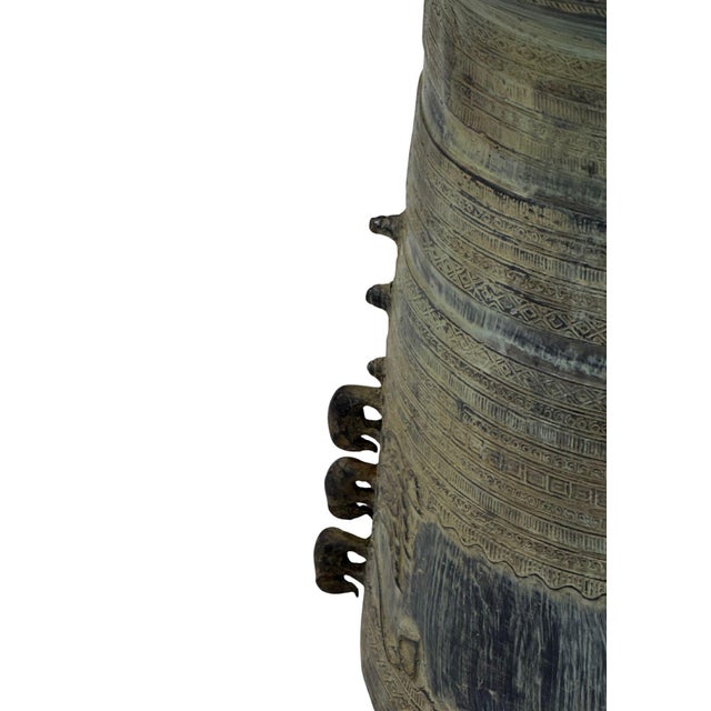 A cast bronze rain drum handcrafted by master artisans on the island of Java, showcasing intricate surface detailing and a...