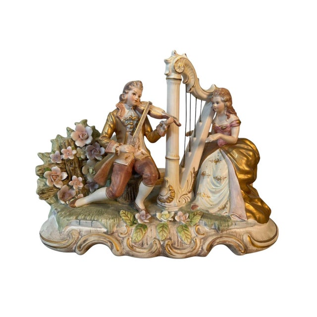 A spectacular vintage Lenwile Ardalt porcelain figural lamp and music box depicting a romantic Rococo-style courting scene...