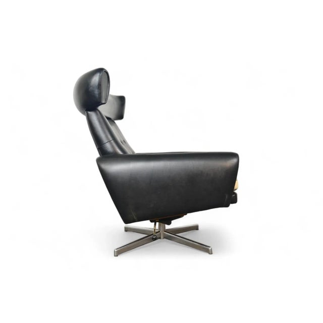 Origin: Denmark Designer: Unknown Manufacturer: Unknown Era: 1960s Materials: Vinyl, Teak Measurements: 30.5″ wide x 30.5″...