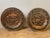 A charming matching pair of vintage embossed copper decorative wall plaques. Each heavy-gauge metal charger features a...