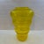 Hand blown sculptural glass vase in pale gold - yellow. It tapers downward in rounded forms creating this tornado form....