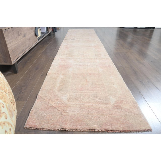 Vintage Turkish Hand-Knotted vintage rug is a semi- vintage runner rug.'70s Eastern region of Turkey's unique rug is...