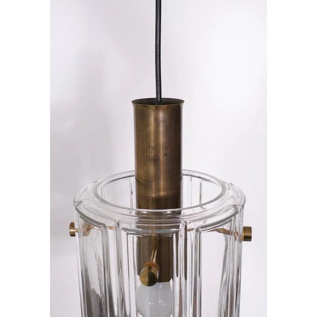 Very nice Pendant lamp, 4 Clear Glass panels connected by Brass pins comes with just amount of patine on the Brass .All...