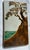 An exquisite Arts and Crafts style studio art pottery tile depicting a stylized cypress tree overlooking coastal waters....
