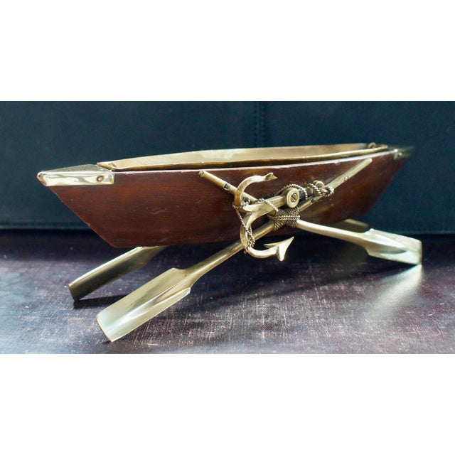 A lovely Victorian Oak rowing boat cruet centre piece. Made from Oak with Brass Oars for a stand, with a hand made brass...