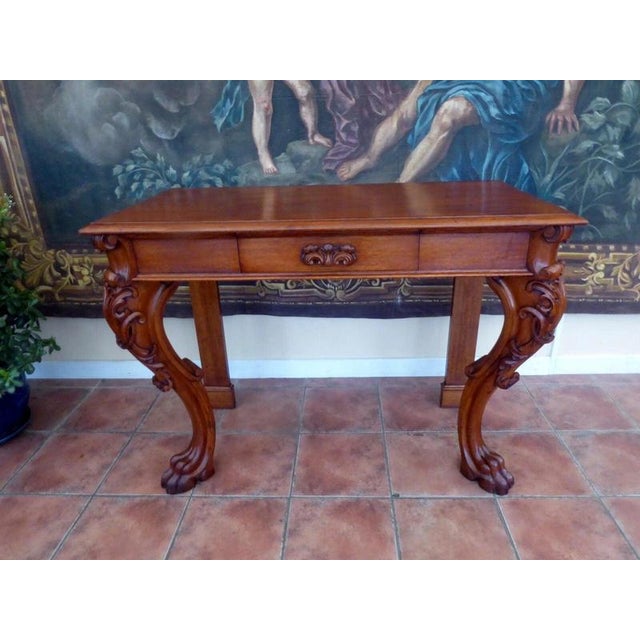 An impressive late 19th-century hall table by renowned English furniture makers Howard & Sons, dating from circa 1880–1900...