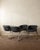 A vintage set of four italian flynn dining chairs in chrome-plated steel with original dark charcoal textile upholstery,...