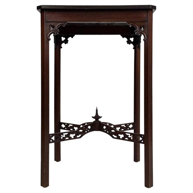 A charming early 20th-century English side table, finely crafted from mahogany and distinguished by its compact...