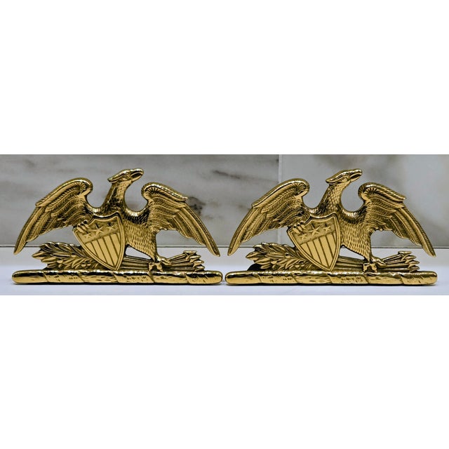 A striking pair of solid brass “Spread Eagle” bookends by Virginia Metalcrafters, dated 1952 and stamped model 8‑9 on the...
