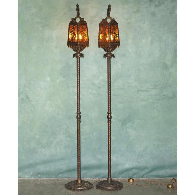 A wonderfully atmospheric pair of early 20th-century Gothic Revival floor lamps, each formed as a tall lantern raised upon...